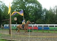 Peter, leading the riders carrying his flag